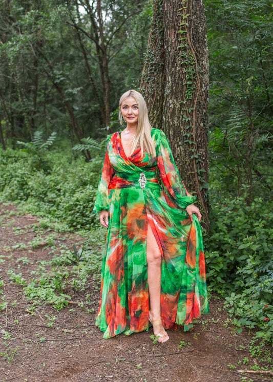 Woman in a colorful dress standing in a forest