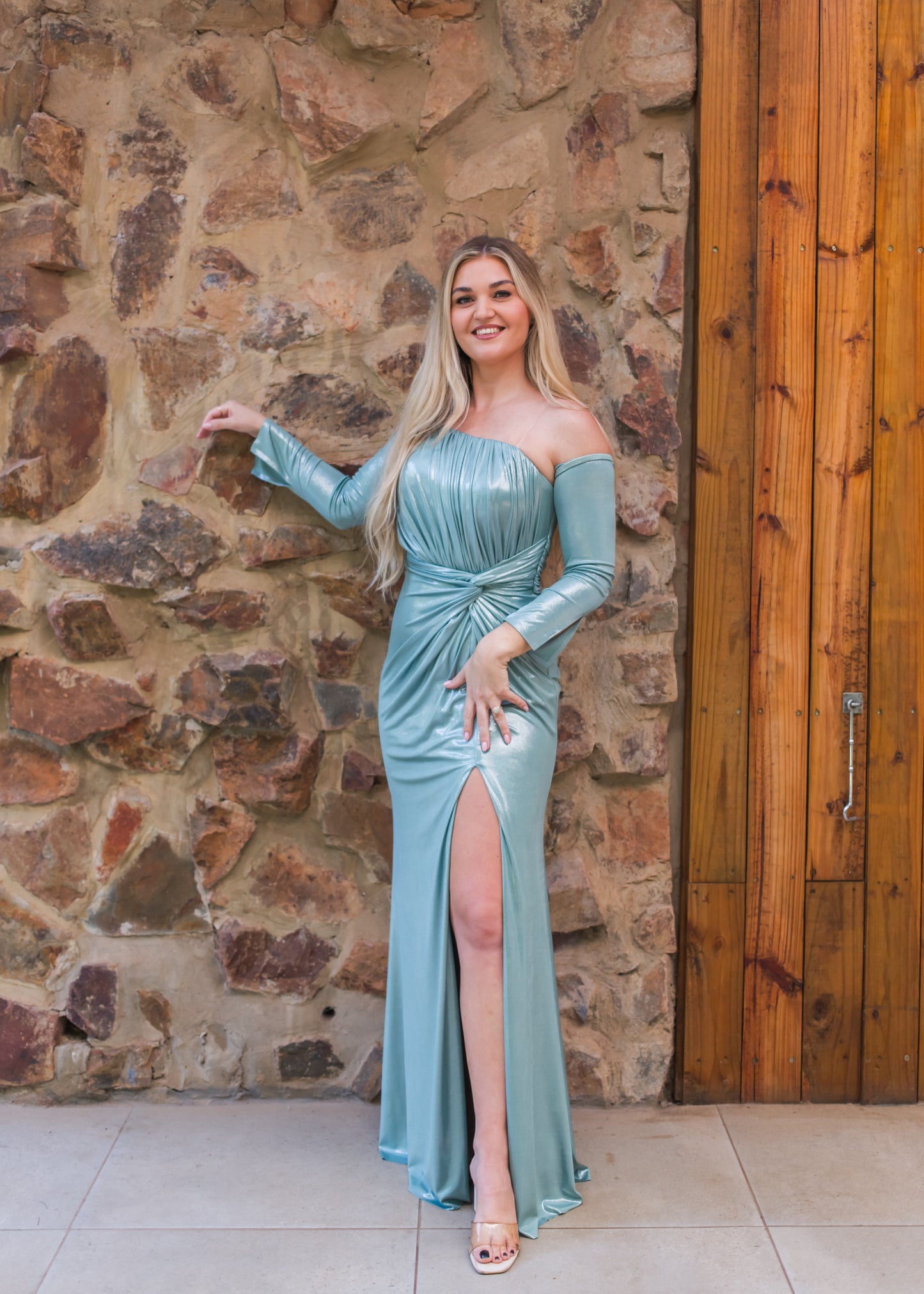 Pale turquoise fitted gown with off the shoulder long sleeves